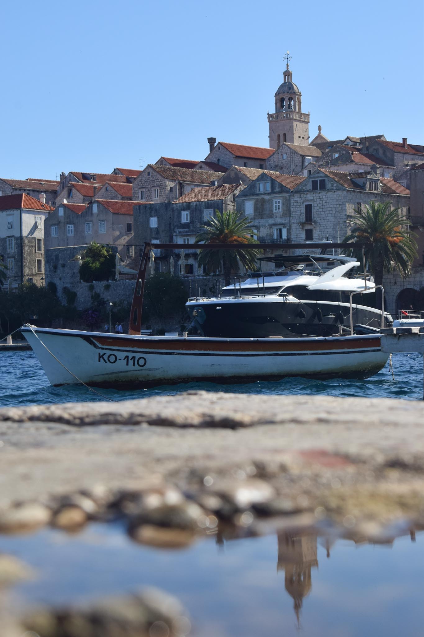 Reflection photography in Korčula, Croatia - coastal landscape and water reflections
